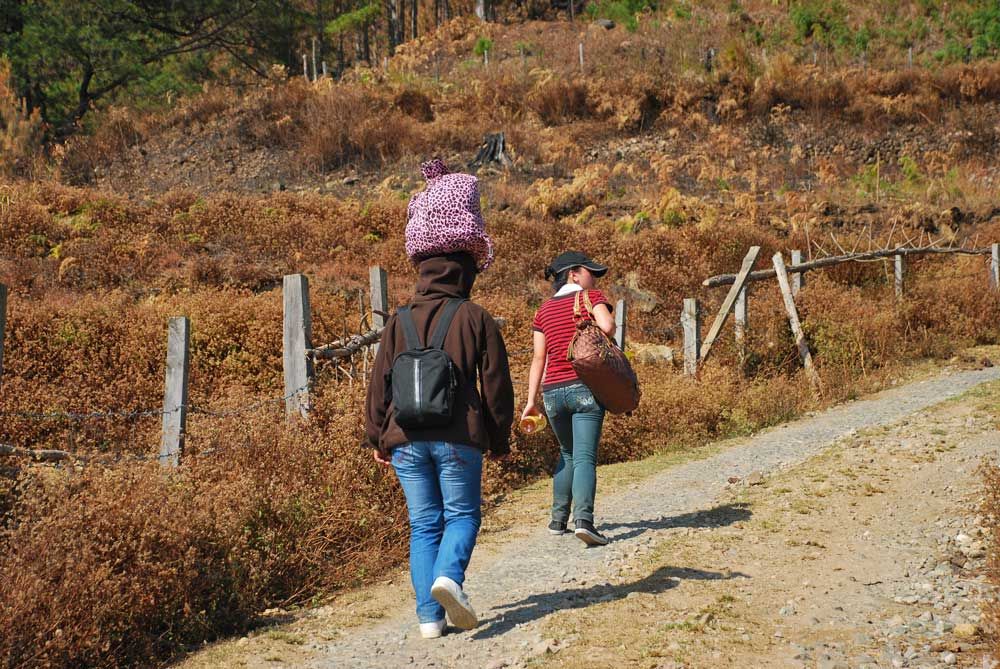 The Philippines _ A Filipino girl carrying her backpack local-style
