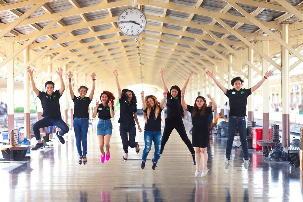 12go staff jumping at Hua Lamphong station