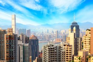 Hong Kong cityscape with modern skyscrapers and blue sky