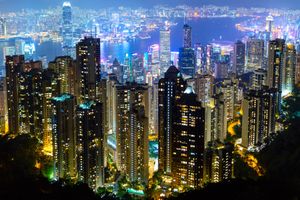 Skyscrapers skyline cityscape in illuminated twilight view from Victoria Peak, Hong Kong Island