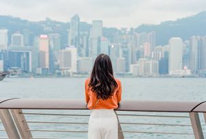 Traveler enjoying Hong Kong cityscape downtown at Victoria Harbour