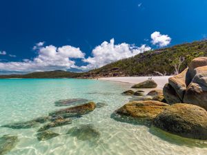 Rocks with white sand on Whitehaven Beach, Whitsunday Islands, Queensland, Australia.
