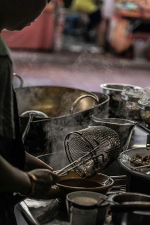 Preparing noodles in Bangkok Chinatown. Credit: Unsplash.